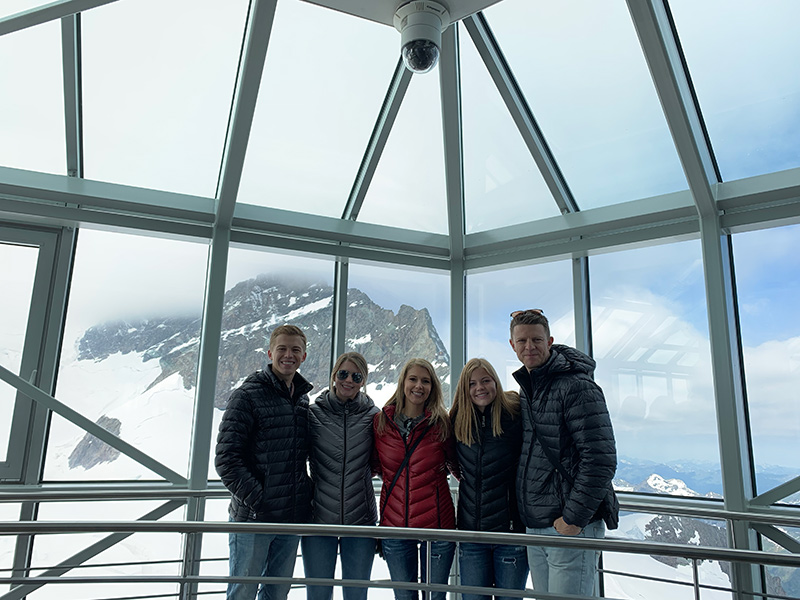 Family standing inside the Sphinx Observatory at Jungfraujoch, Switzerland
