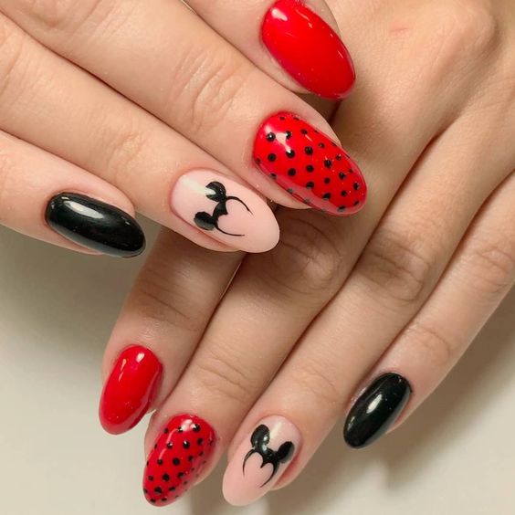 Something feels a little devious about the mouse ears on these rounded nails. Is it the pointed sides or the fire-engine red next to them? 