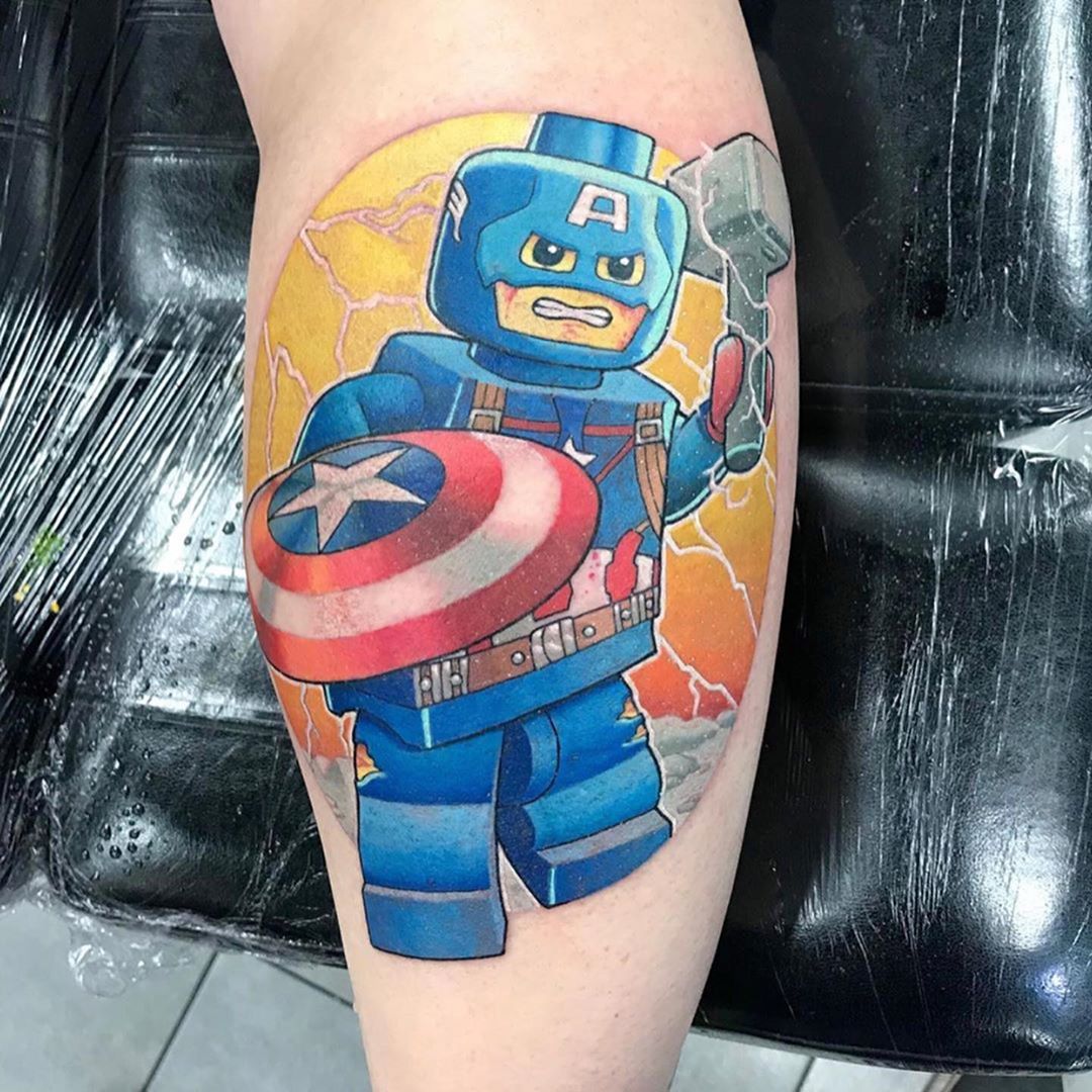 Captain America holding Thor's hammer LEGO tattoo