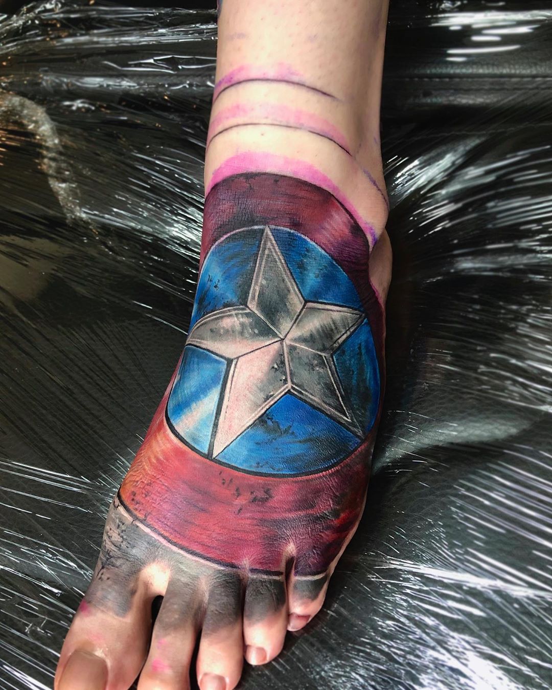 Captain America foot tattoo