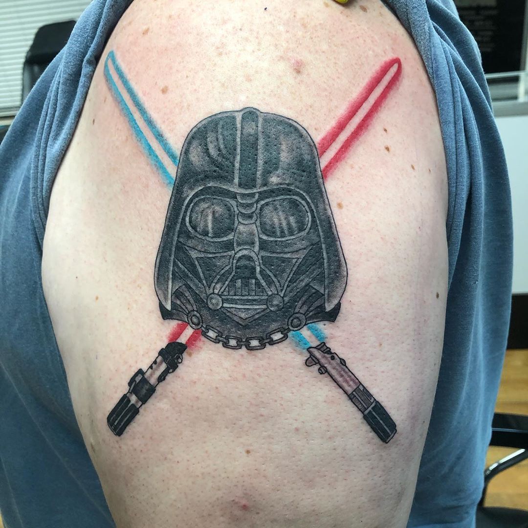 Darth Vader with crossed lightsabers in shoulder tattoo