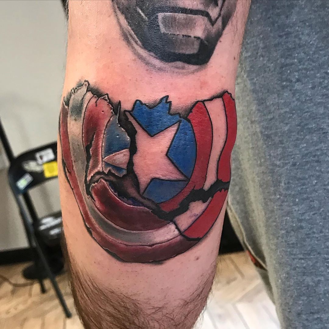 Captain America broken shield tattoo