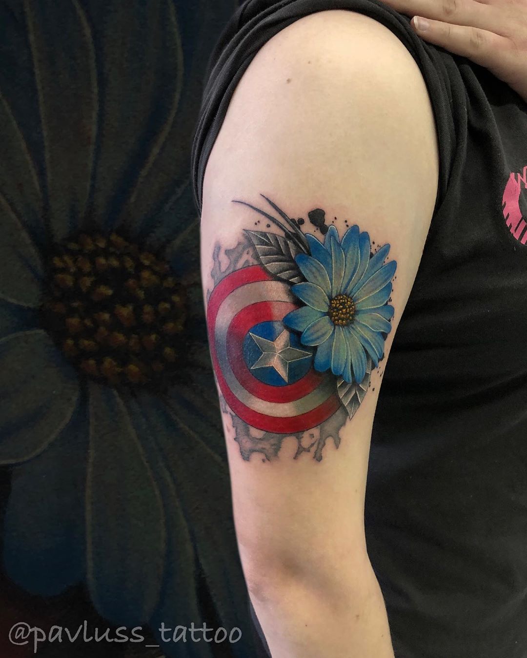 Captain America's shield and flower tattoo
