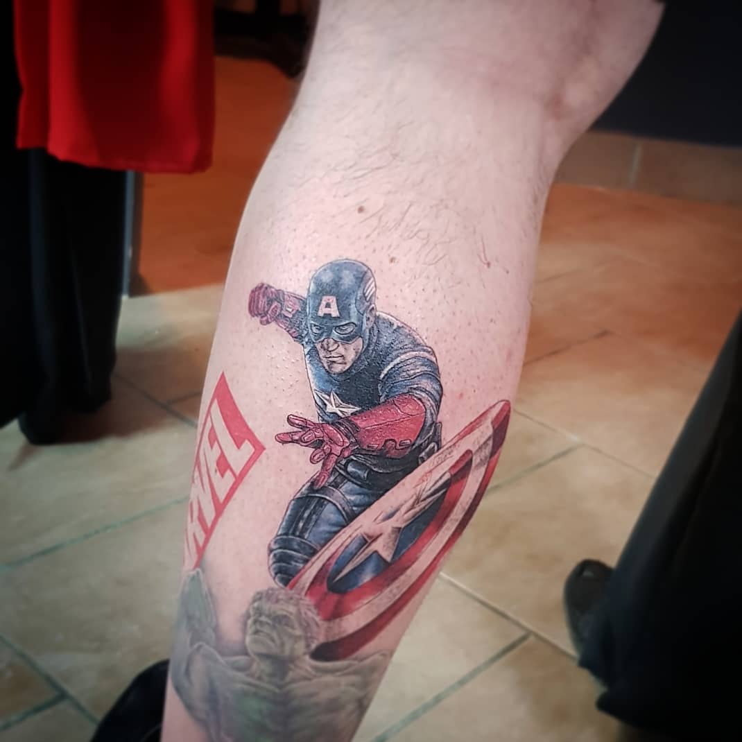 Captain America throwing shield tattoo