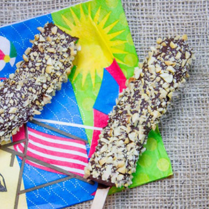 chocolate dipped bananas covered with toffee and coconut