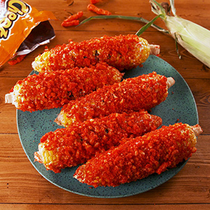 corn on the cob covered in cheetos