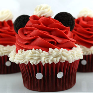 Mickey Mouse themed cupcakes with Santa hats